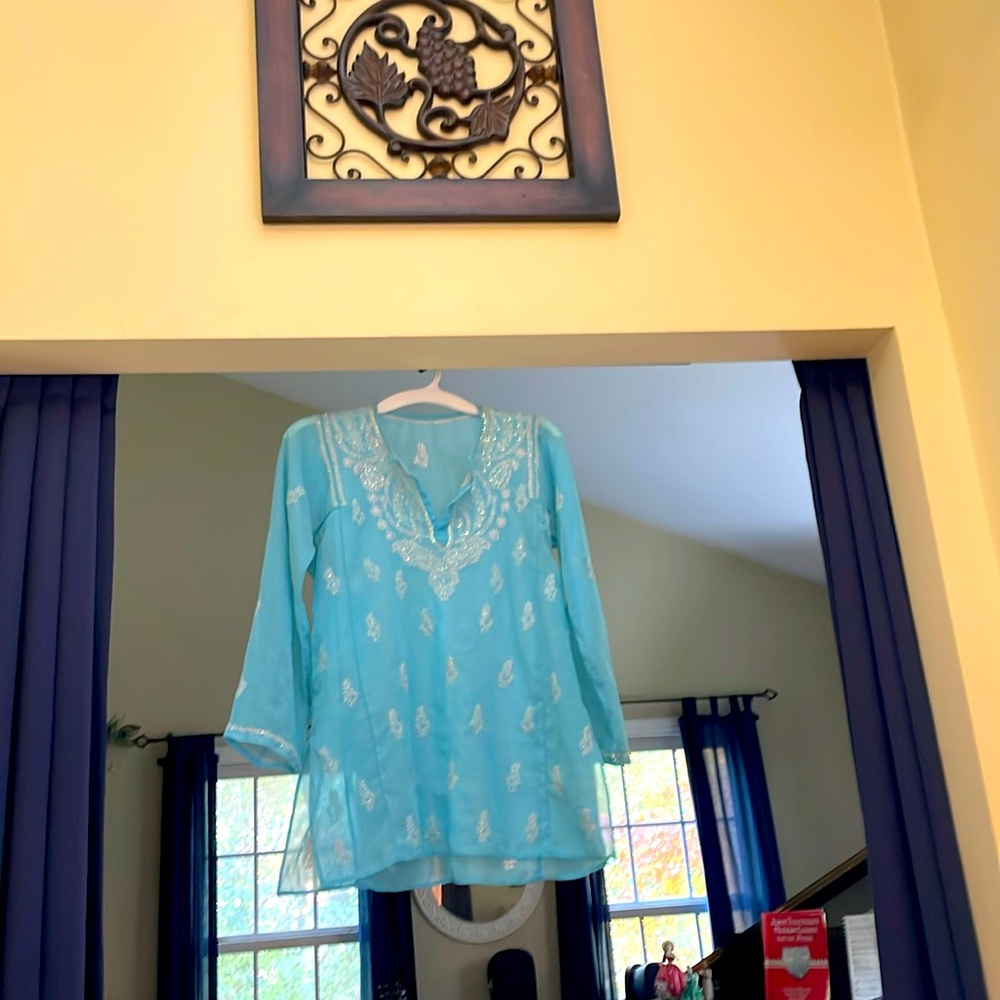 Top with sequins and detailed embroidery